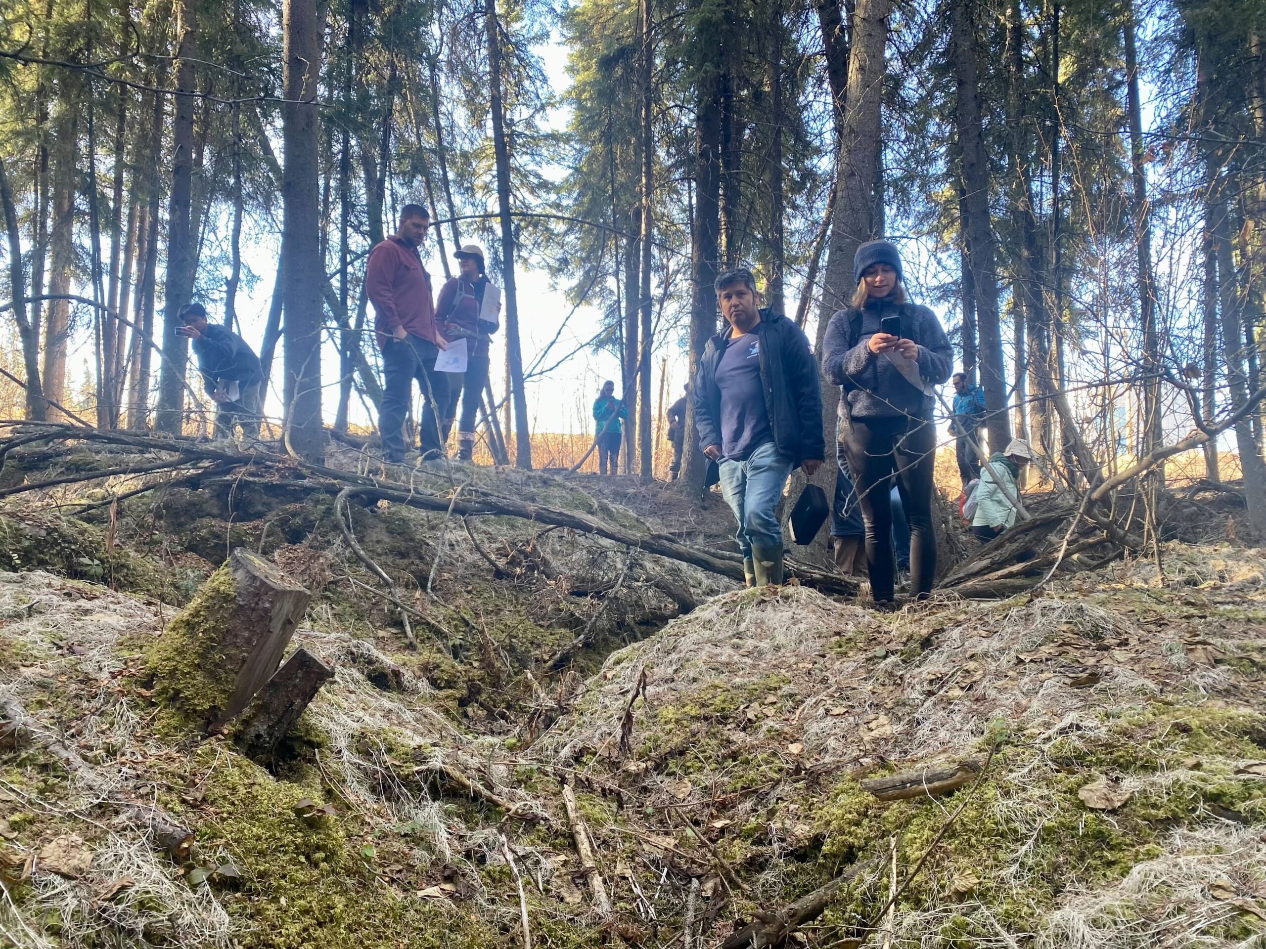 NCSA researchers explore the once-flat terrain that has been reshaped following melting of the underground permafrost in Alaska.