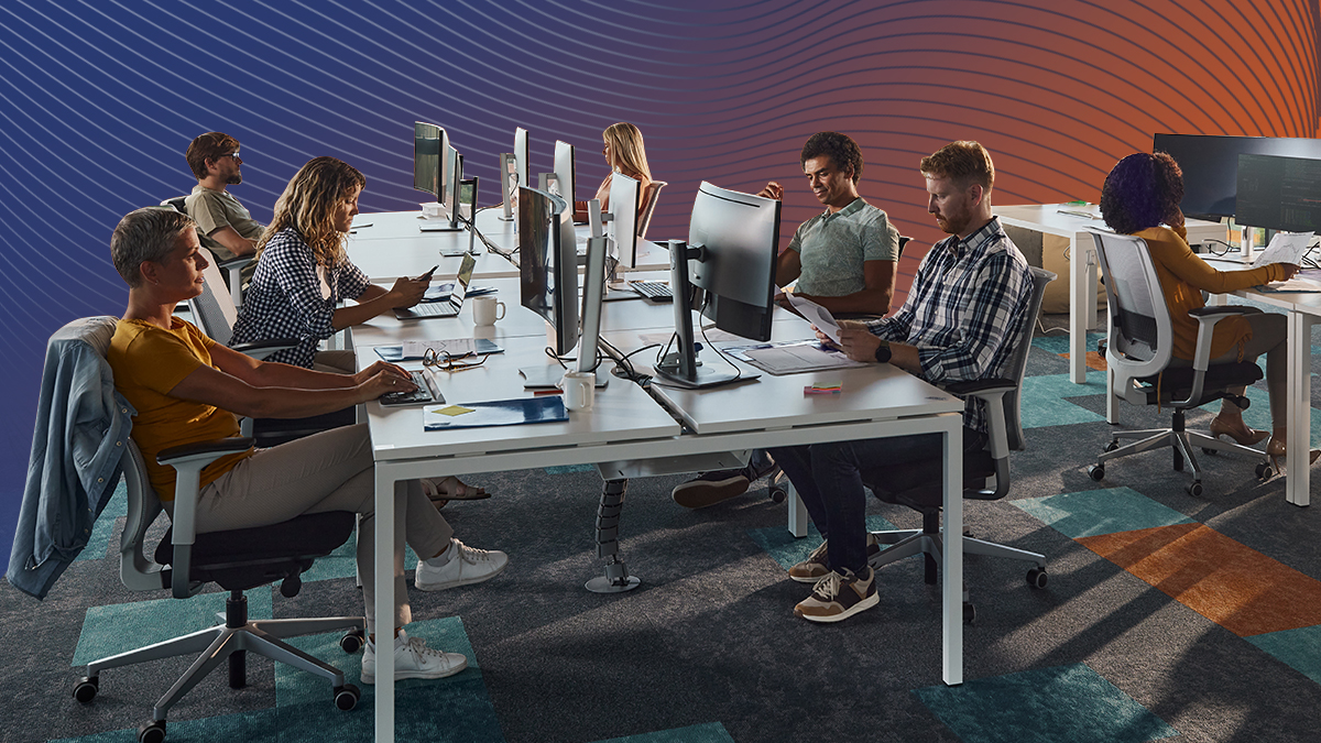 Many people working on developer projects at workstations with an orange and blue gradient background