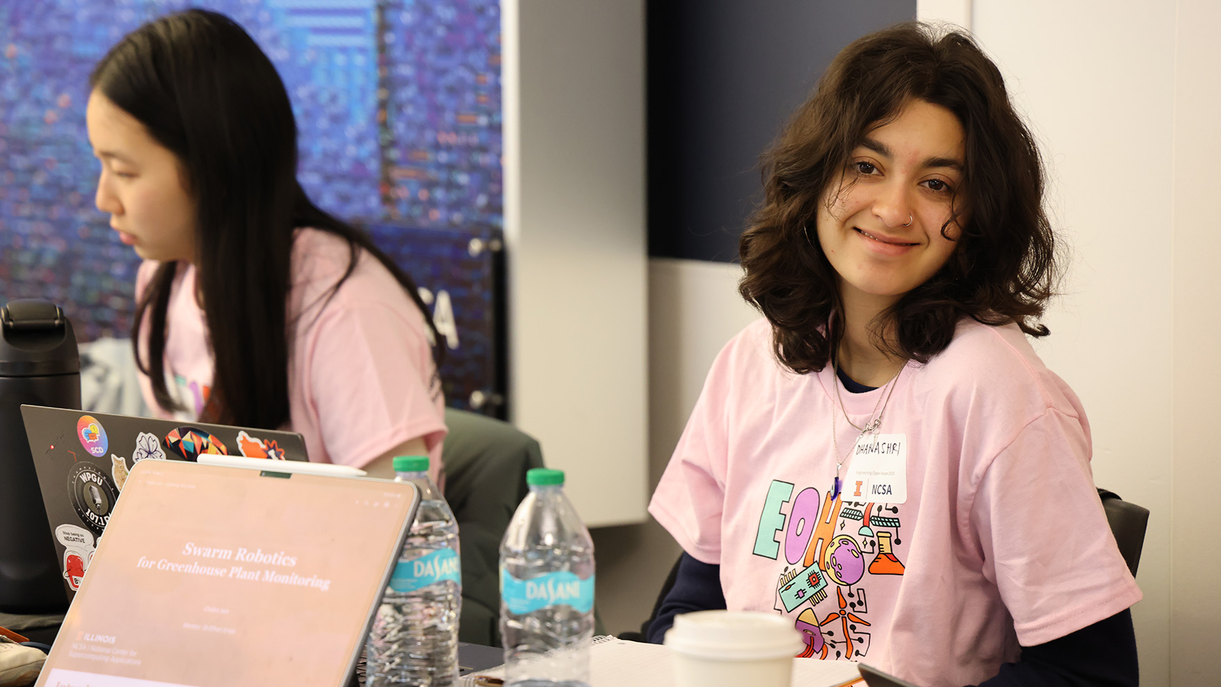 A picture of two SPIN interns staffing a table at EOH.