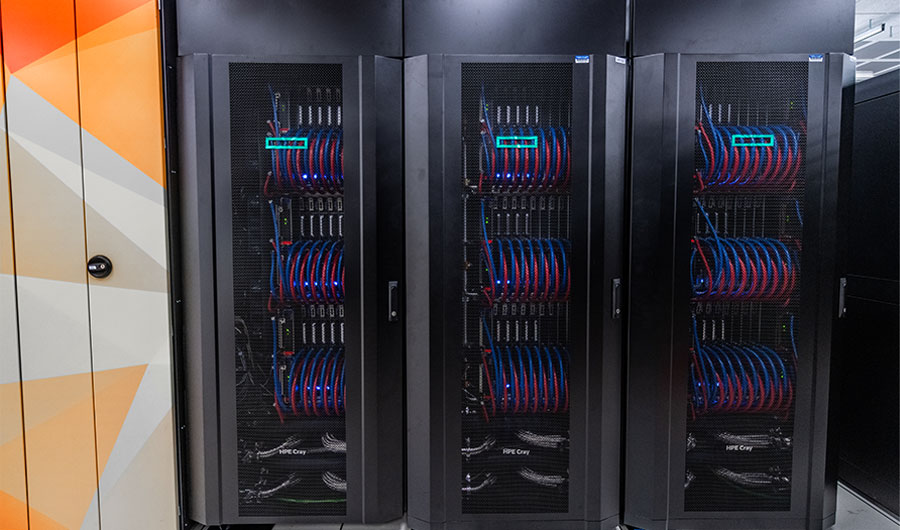DeltaAI racks at NPCF. The cabinets are metal mesh and inside are various supercomputer components